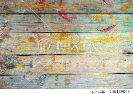 Rustic wooden surface with colorful paint splashes and marks Rustic wooden surface with colorful paint splashes and marks 136189068