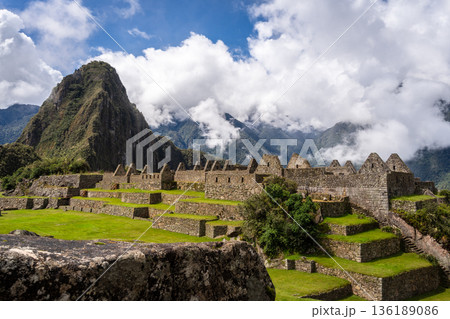 Panoramic view of Machu Picchu ruins with Huayna Picchu in background, Peru 136189086