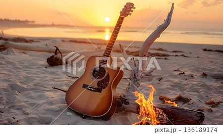 夕焼けの浜辺に佇むギターと夏の旅の思い出 136189174
