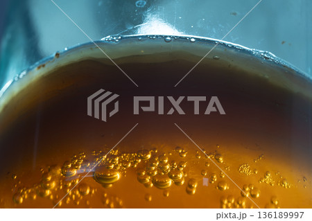 Artisan Fermentation Scene Showing Probiotic Beverage With Glowing Bubbles And Contrasting Backlight Artisan Fermentation Scene Showing Probiotic Beverage With Glowing Bubbles And Contrasting Backlight 136189997