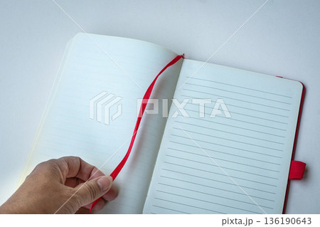 Open lined notebook with red bookmark Open lined notebook with red bookmark 136190643