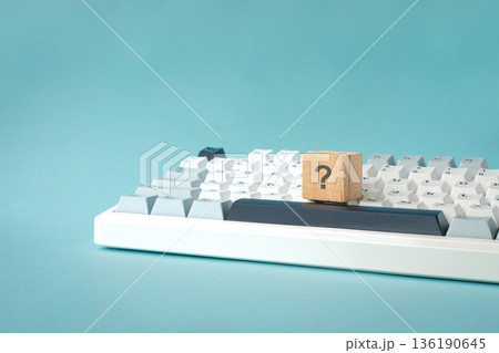 Question mark on wood block on top of keyboard. Question mark on wood block on top of keyboard. 136190645