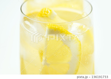 Homemade lemonade with lemon on a white background Homemade lemonade with lemon on a white background 136191733