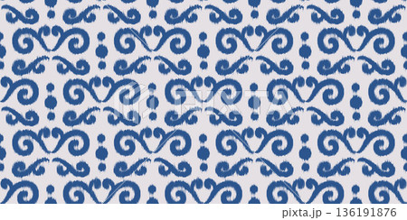 Ikat ethnic seamless pattern. Abstract blue floral print. Rug textured traditional oriental ornament for textile and fabric. Decorative trendy dye background. Ikat ethnic seamless pattern. Abstract blue floral print. Rug textured traditional oriental ornament for textile and fabric. Decorative trendy dye background. 136191876