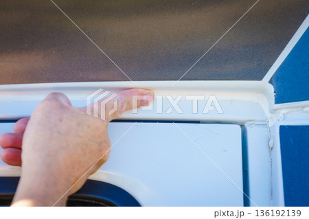 Applying silicon on caravan body 136192139