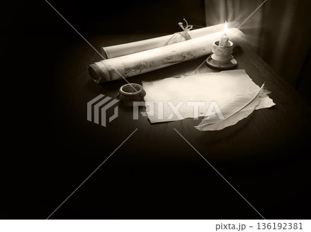Paper and quill on the table 136192381