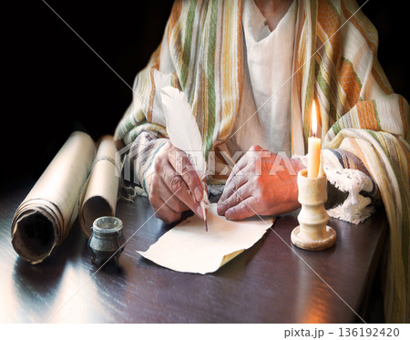 Male hand witn big quill Male hand witn big quill 136192420