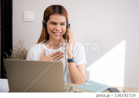 Professional young business woman working and meeting online in modern home office. 136192719