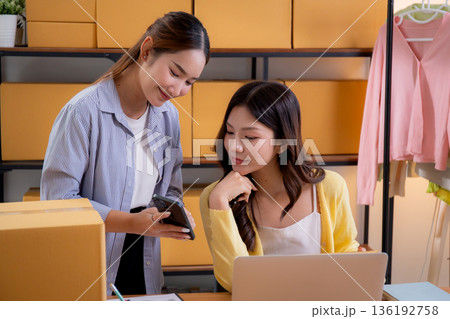 Two asian woman working in small business online store, online seller. 136192758