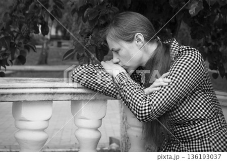 Sad girl in the park 136193037