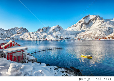 Amazing winter view of  fishing village on Sundstraumen strait that separates Moskenesoya and Flakstadoya islands. 136193554