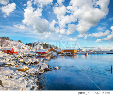Outstanding winter scenery of Moskenes village with ferryport and famous Moskenes parish Church. Outstanding winter scenery of Moskenes village with ferryport and famous Moskenes parish Church. 136193566