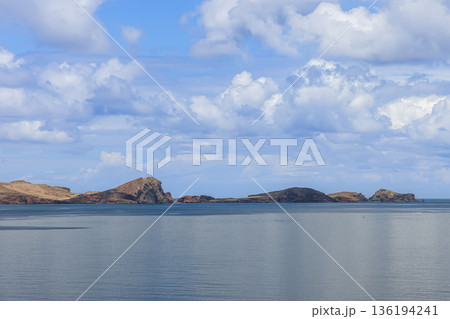 Point of Saint Lawrence Madeira peninsula silhouette over Atlantic with vast sky and calm horizon Point of Saint Lawrence Madeira peninsula silhouette over Atlantic with vast sky and calm horizon 136194241