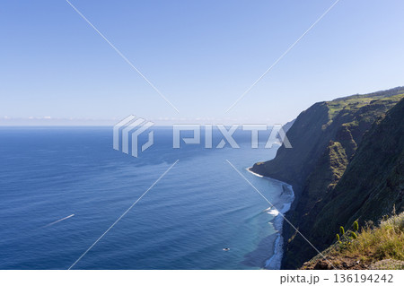 Atlantic coastline at Ponta do Pargo Madeira with towering sea cliffs and calm open water view Atlantic coastline at Ponta do Pargo Madeira with towering sea cliffs and calm open water view 136194242