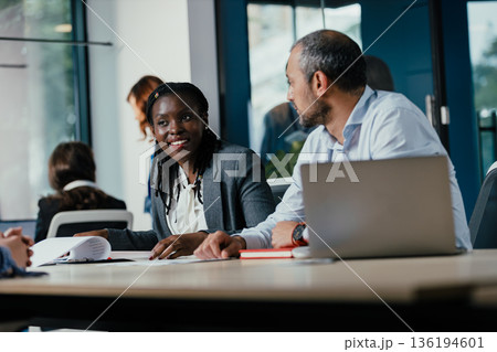 Diverse business professionals collaborating in an office meeting 136194601