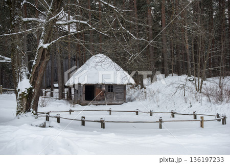 Latvian old wooden house with elaborate wooden columns. 136197233