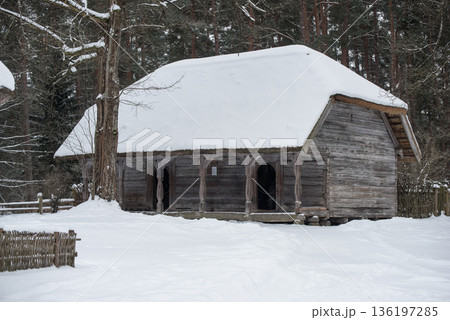 Latvian old wooden house with elaborate wooden columns. 136197285