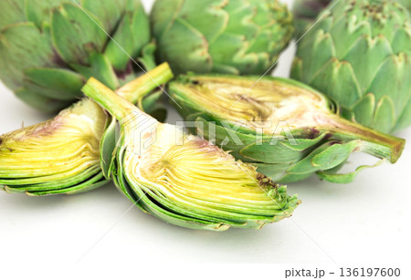 green artichokes on white background green artichokes on white background 136197600