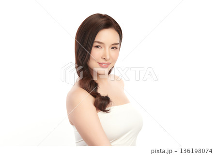 A beautiful young Asian woman with clean, fresh skin against a white background. Skincare, facial treatment, cosmetology, beauty, and spa. An elegant portrait of an Asian woman. A beautiful young Asian woman with clean, fresh skin against a white background. Skincare, facial treatment, cosmetology, beauty, and spa. An elegant portrait of an Asian woman. 136198074