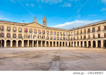Wide view of Spain square in Vitoria-Gasteiz, featuring neoclassical arcaded facades, balconies and Wide view of Spain square in Vitoria-Gasteiz, featuring neoclassical arcaded facades, balconies and 136199907
