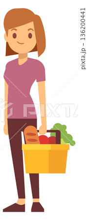 A woman is holding a basket full of vegetables and fruits A woman is holding a basket full of vegetables and fruits 136200441