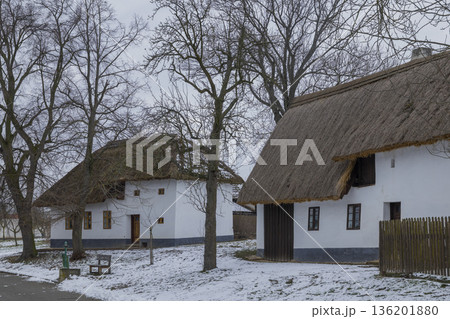 Traditional thatched roof houses in snowy Rymice, Czechia 136201880