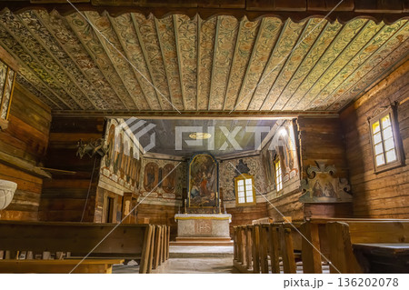 Traditional wooden church interior with ornate painted ceiling in Zuberec, Slovakia Traditional wooden church interior with ornate painted ceiling in Zuberec, Slovakia 136202078