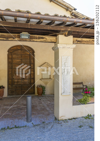 Traditional Italian architecture with relief sculpture in Foligno, Umbria 136202112