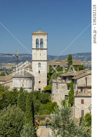 Assisi bell tower rising above historic houses 136202119