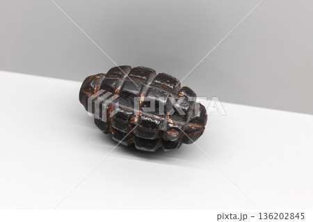 Soviet F-1 hand grenade is on white shelf 136202845