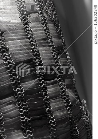 An ancient chain mail with steel rings and plates An ancient chain mail with steel rings and plates 136202849