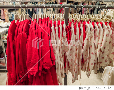 Red and White Kids Sweaters on Rack Red and White Kids Sweaters on Rack 136203012