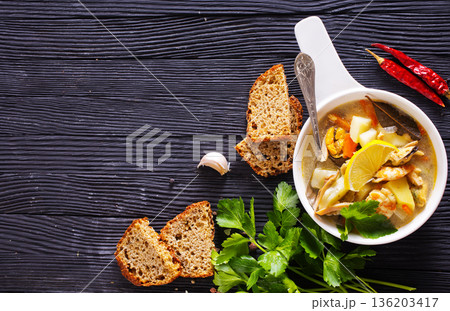 A popular dish of Asian cuisine - soup with shrimps Traditional spicy soup close-up A popular dish of Asian cuisine - soup with shrimps Traditional spicy soup close-up 136203417