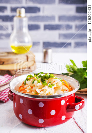 Salad with cabbage, sauerkraut cabbage in a bowl on a rustic table. 136203435