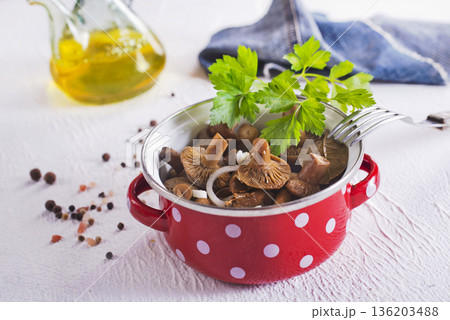 Salted mushrooms, autumn harvest. Homemade pickled mushrooms, marinated red mushrooms with spice and salt 136203488