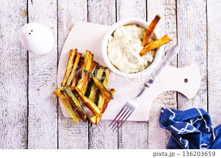 Baked crispy eggplant sticks served with white sauce. Vegetarian healthy dish. Baked crispy eggplant sticks served with white sauce. Vegetarian healthy dish. 136203659
