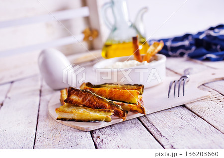 Baked crispy eggplant sticks served with white sauce. Vegetarian healthy dish. Baked crispy eggplant sticks served with white sauce. Vegetarian healthy dish. 136203660