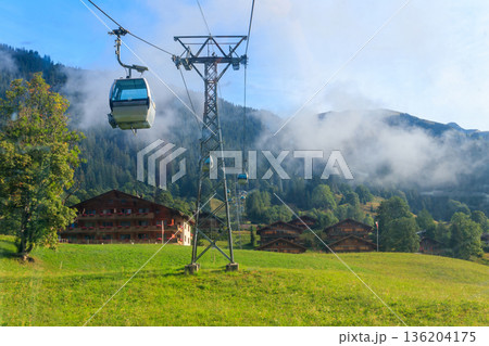 Overhead cable car to First mountain, Grindelwald, Switzerland Overhead cable car to First mountain, Grindelwald, Switzerland 136204175