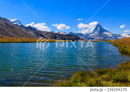 View of Stelli Lake (Stellisee) and Matterhorn mountain at summer in Zermatt, Swiss Alps, Switzerland View of Stelli Lake (Stellisee) and Matterhorn mountain at summer in Zermatt, Swiss Alps, Switzerland 136204179