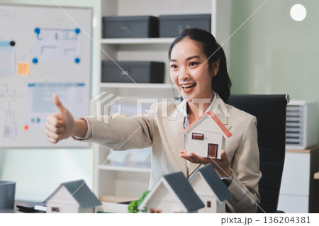 real estate agent home miniature model on documents sale and purchase of apartment notarial deed real estate agent home miniature model on documents sale and purchase of apartment notarial deed 136204381