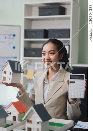 real estate agent home miniature model on documents sale and purchase of apartment notarial deed real estate agent home miniature model on documents sale and purchase of apartment notarial deed 136204382