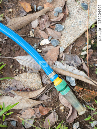 Garden Water Hose with Adjustable Spray Nozzle. Garden Water Hose with Adjustable Spray Nozzle. 136204492