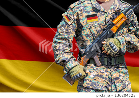 Germany flag with soldier holding assault rifle Germany flag with soldier holding assault rifle 136204525