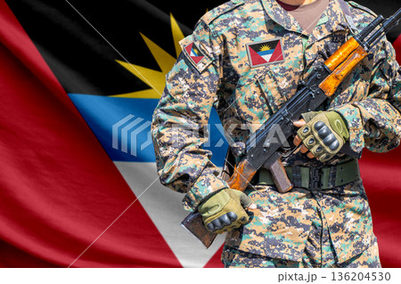Antigua and Barbuda flag with soldier holding assault rifle 136204530