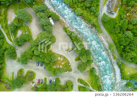 Top view of mountain valley and river. Briksdalsbreen mountain river near Volefossen. Car parking before the Briksdal glacier hike. Oldedalen, Norway 136206264