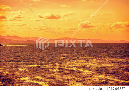 Cloudy sky over the sea at golden sunset. Abstract nature background. Donostia, San Sebastian, Basque Country, Spain 136206272