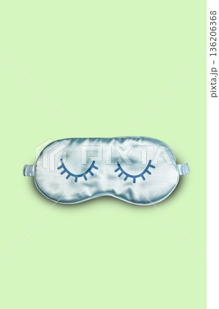 Funny blue sleeping mask with illustrated closed eyes on yellow background. Vertical brochure for World Sleeping Day concept Funny blue sleeping mask with illustrated closed eyes on yellow background. Vertical brochure for World Sleeping Day concept 136206368