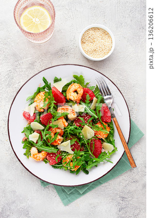 Fresh shrimp salad with arugula, grapefruit, and parmesan served in a bowl Fresh shrimp salad with arugula, grapefruit, and parmesan served in a bowl 136206612