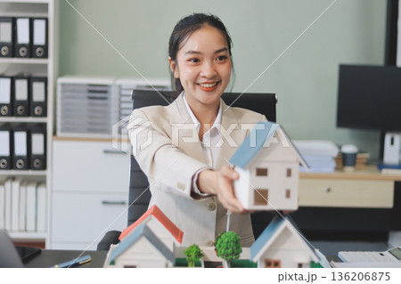 real estate agent home miniature model on documents sale and purchase of apartment notarial deed real estate agent home miniature model on documents sale and purchase of apartment notarial deed 136206875