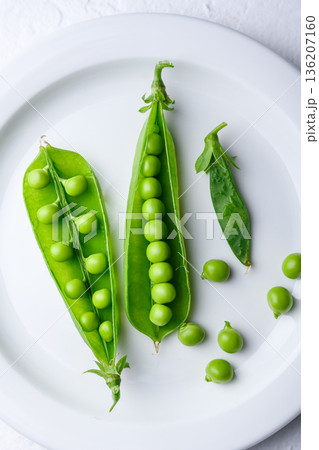 Green peas served on a white plate Green peas served on a white plate 136207160